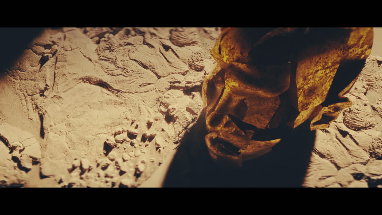 Huge golden statues in the desert during sunset