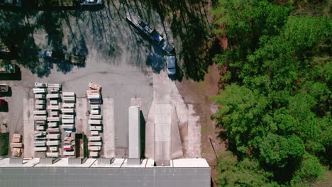 semi truck driver with flatbed load waiting for dispatch to call him for unloading his trailer