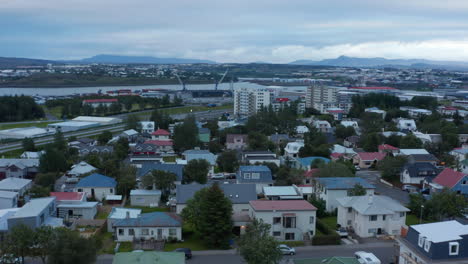 Birds-eye-over-Reykjavik-colorful-rooftop-coastline.-Travel-destination.-European-capital-city.-Aerial-view-of-the-largest-cargo-port-in-Iceland,-Sundahofn-in-Reykjavik.-Commercial-and-trading