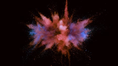 super slow motion of colored powder explosion isolated on dark background.