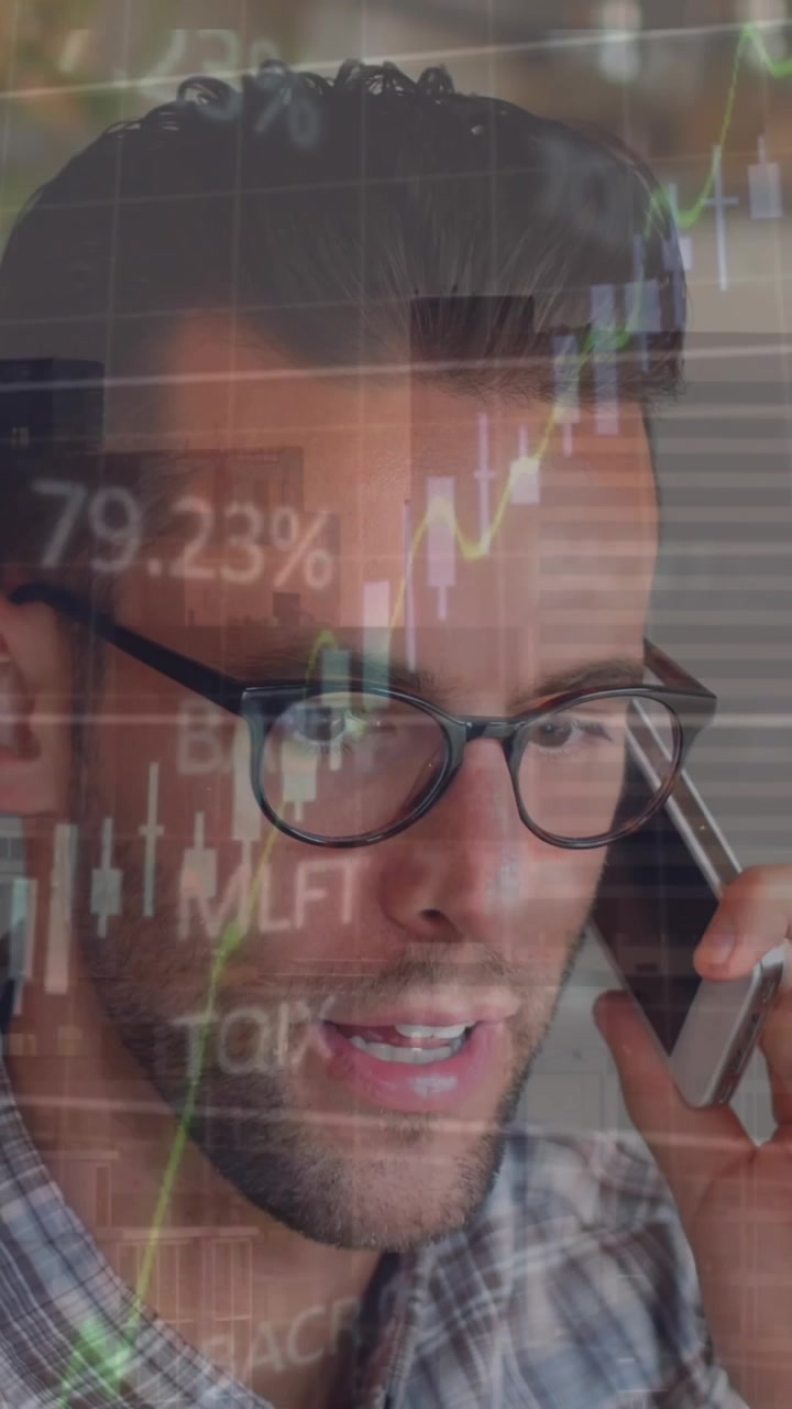 Animation of financial data processing over man talking on smartphone against tall building