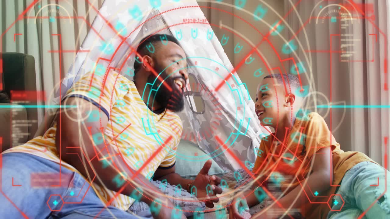 Father and son reclining in teepee, father handing handheld toy and sparking learning, HUD rotating