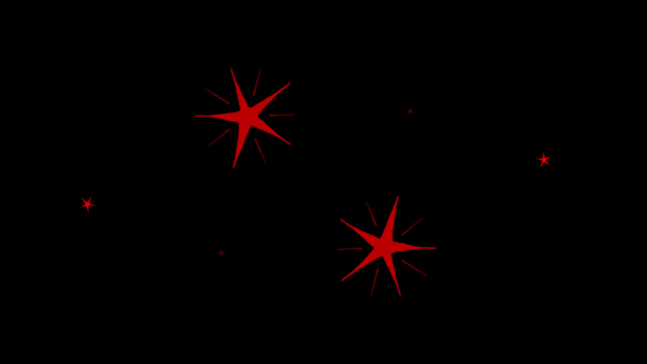 animación estrellas rojas en forma de chispas en fondo negro.