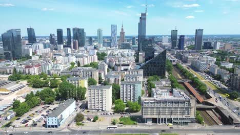 Aerial-panorama-of-Warsaw,-Poland-over-the-Vistual-river-and-City-center-in-a-distance