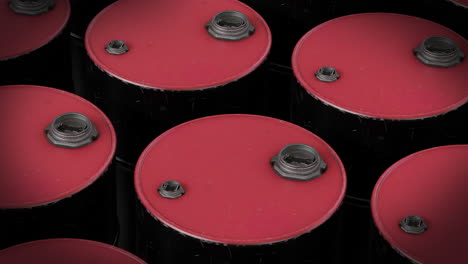 video of multiple red barrels on black background