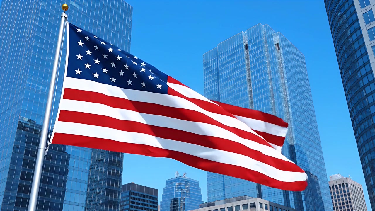 Bandiera americana che sventola contro moderni grattacieli di vetro in città