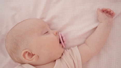 sleeping baby with pacifier