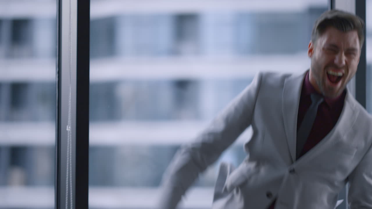 Euphoric business man celebrating career success