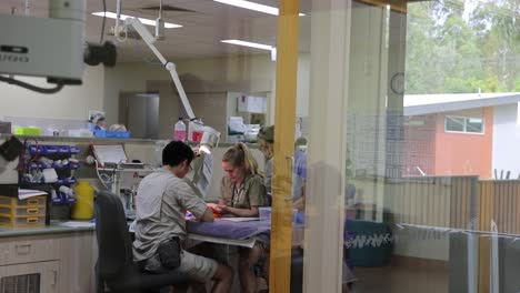 colleagues discussing over documents in a lab