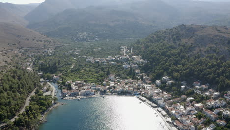 aerial tilts down to aegean waterfront bay in lagkada on chios greece