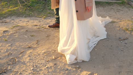 Husband and wife walking after ceremony, low angle view