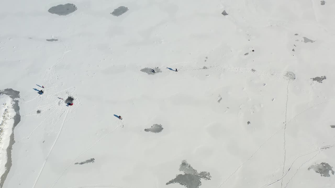 Ice Fisher running across frozen lake