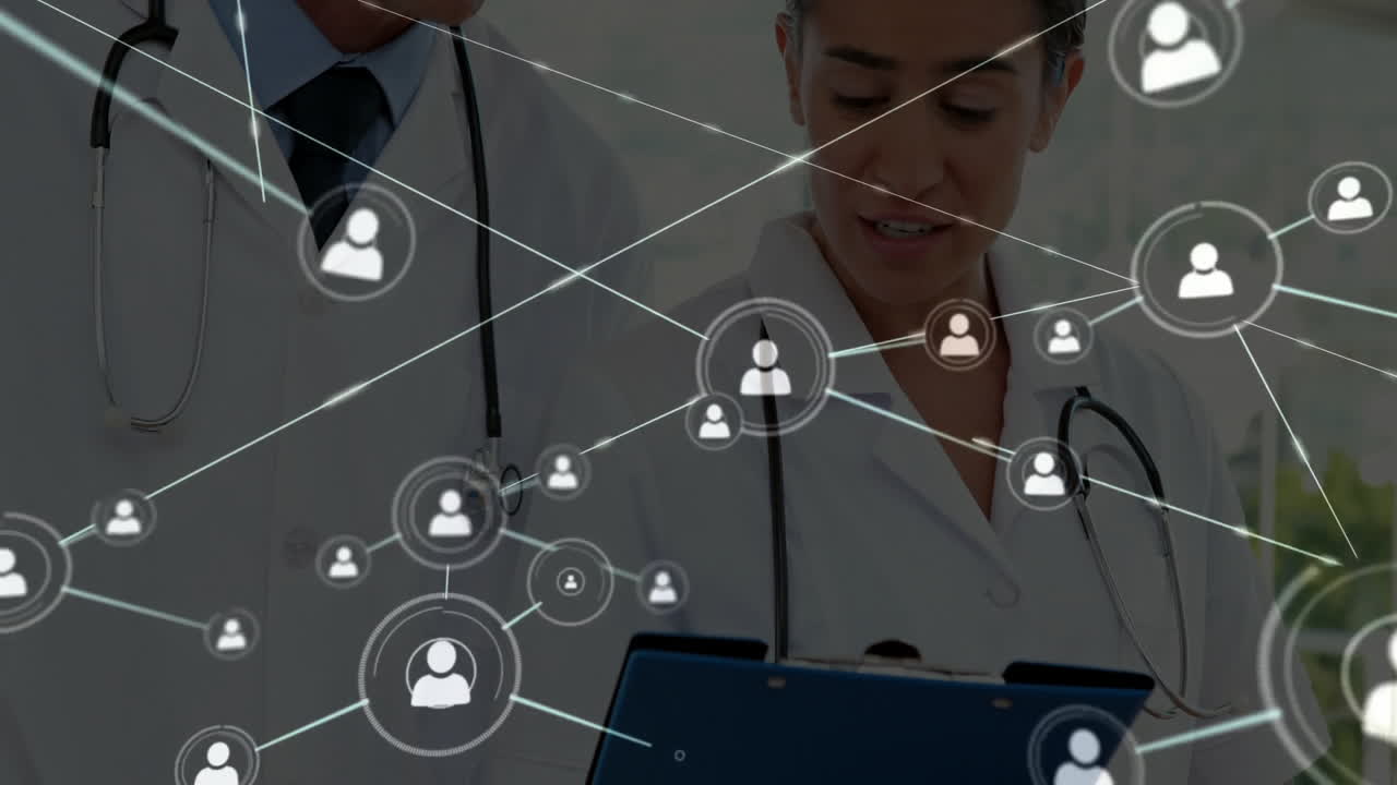 Two doctors wearing stethoscopes sharing medical data indoors, over floating user icon network