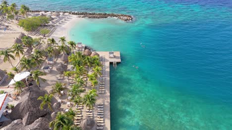 drone tilt down reveals caribbean getaway at zanzibar beach jan thiel curacao