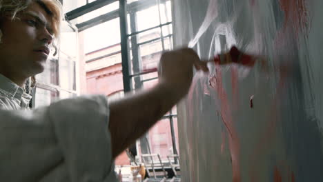 passionate artist painting indoors