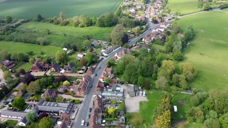 following a quiet road through a village in kent, uk