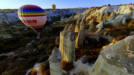 glide over cappadocia’s stunning valleys in a hot air balloon as the first light of dawn reveals dramatic views