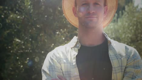 man wearing a straw hat in the countryside