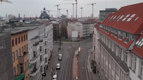 AERIAL:-Slow-flight-through-Empty-Central-Berlin-Neighbourhood-Street-with-Almost-No-People-and-No-Cars-during-Coronavirus-COVID-19-on-Overcast-Cloudy-Day