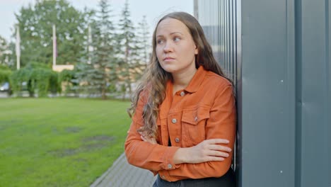 stable shot, stressed woman waiting for somebody outside in park