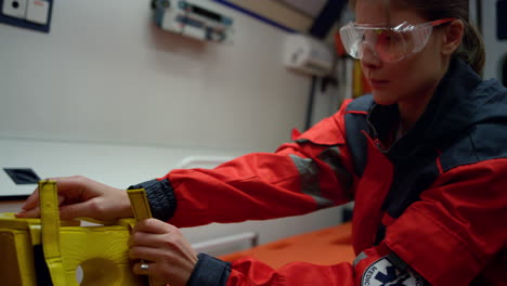 female medical assistant preparing stretcher