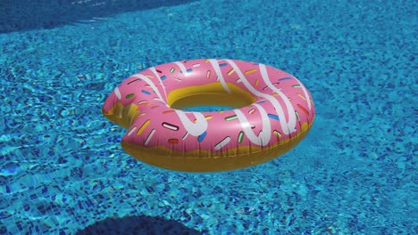 donut inflable rosado flotando en la piscina 4k