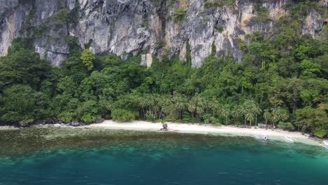 aerial wide shot of pasandigan cove on cadlao island, el nido