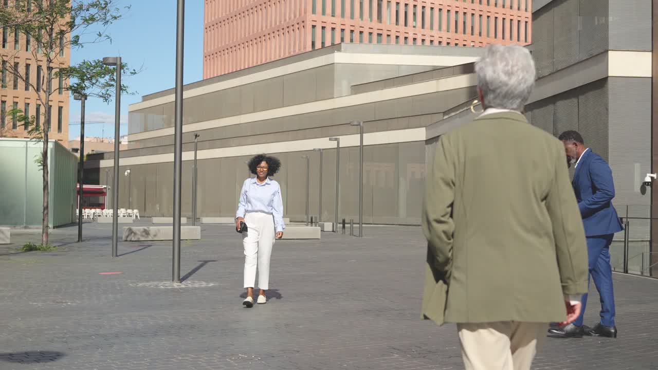 Financial district with business people walking in the rush hour