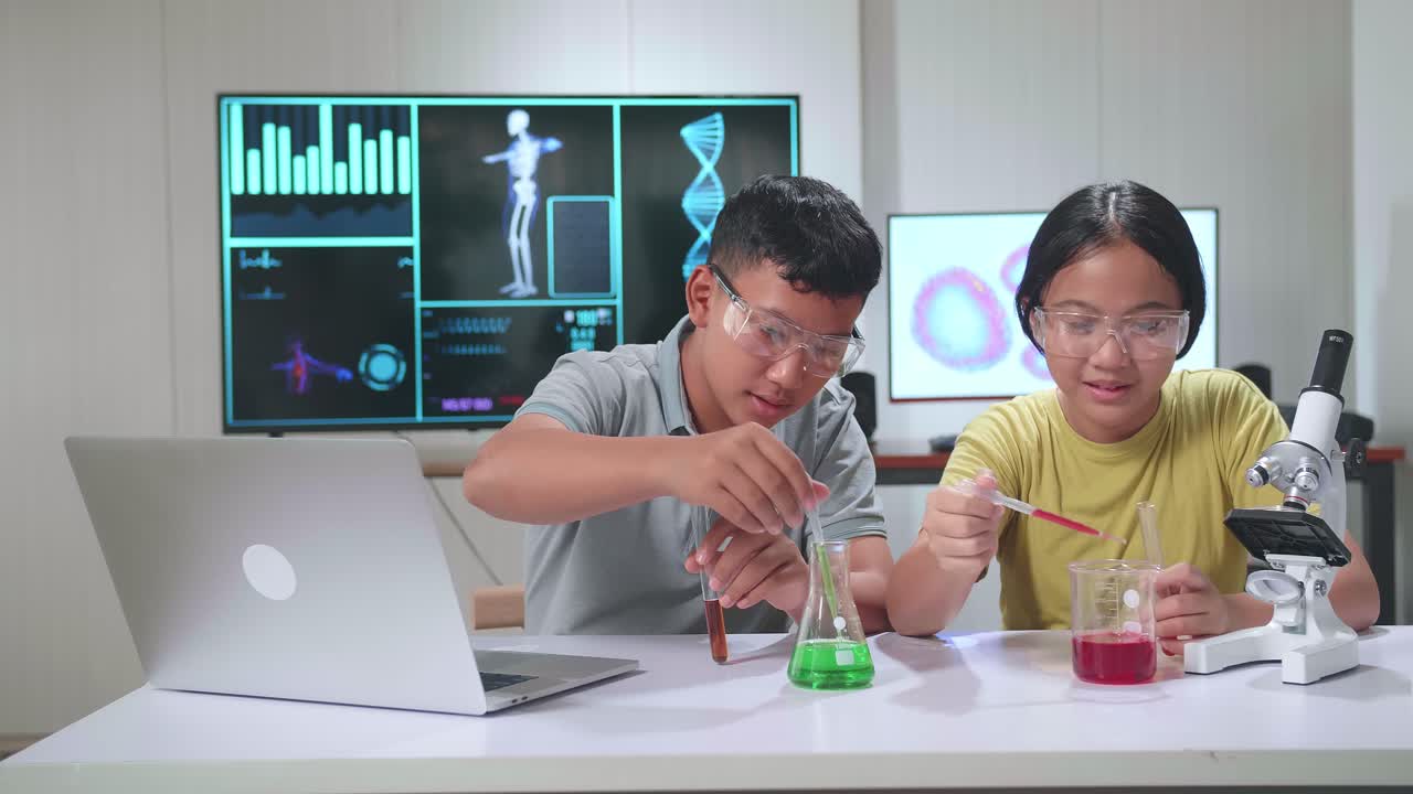 Excited Young Asian Boy And Girl Learning Science Experiment In Laboratory At Classroom. Study With Scientific Equipment And Test Tubes