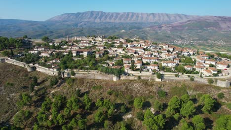 berat's strong stone walls: guardians of the hilltop city with beautiful white houses and thousand windows, albania destination