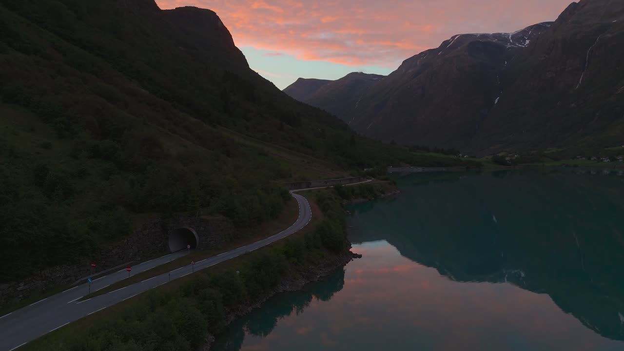 Oldevatnet lake sunset at Briksdalsbreen glacier. Scenic Norway Scandinavia nature water reflection