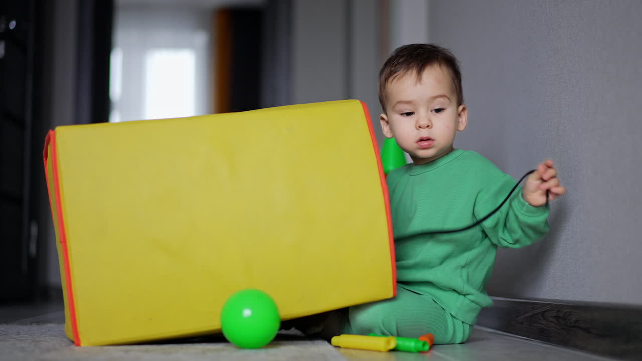 Baby Playing with Toys in a Box