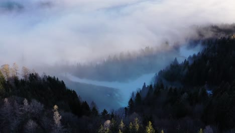 drone footage from mountain over the clouds