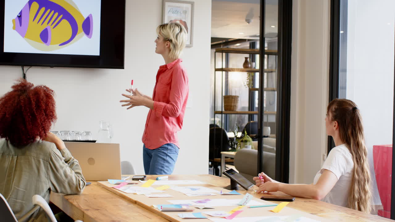 Presenting creative ideas, woman standing and pointing at screen in business meeting