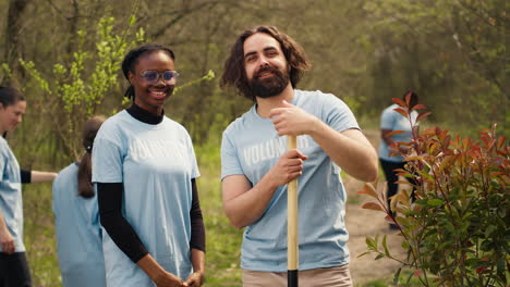 Portrait-of-diverse-activists-team-tidying-natural-environment