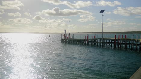 people fishing off the edge of inverloch jetty in australia