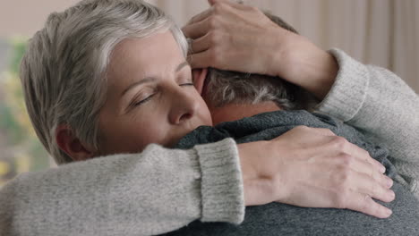 sad mature woman hugging husband sharing bad news to emotional wife couple embracing stressful retirement marriage problems 4k footage