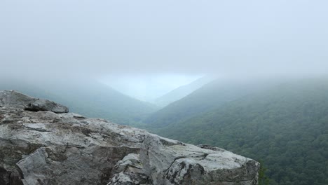 low clouds pass over the red creek valley, as seen from the rohrbaugh cliffs in the dolly sods wilderness, part of the monongahela national forest in west virginia