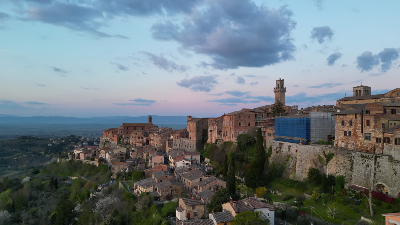 Aerial drone view of the Montepulciano medieval hilltop town in Tuscany, Italy, surrounded by vineyards