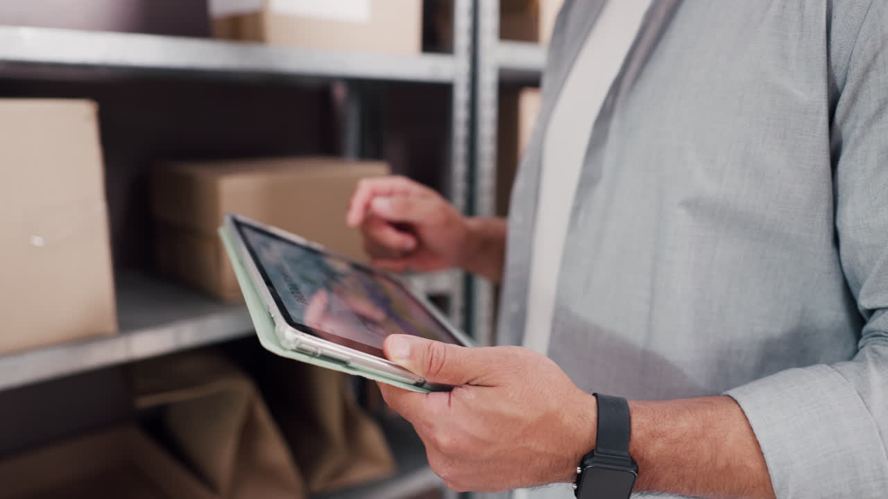 Man Using Digital Tablet to Manage Inventory in Warehouse