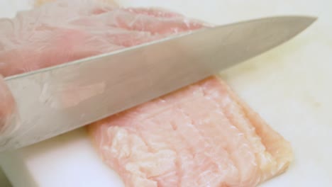 white fish meat is prepared by the chef