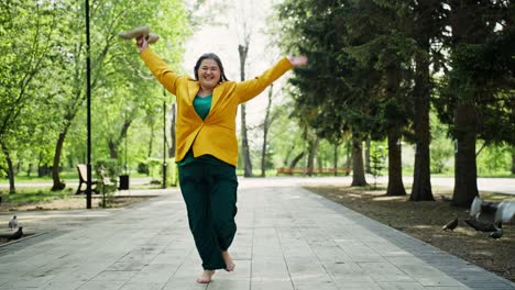 happy plus size woman walking in park