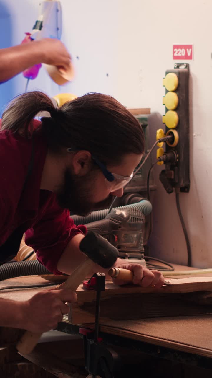 Skilled Craftsman Carving Wood with Chisel and Hammer in Workshop
