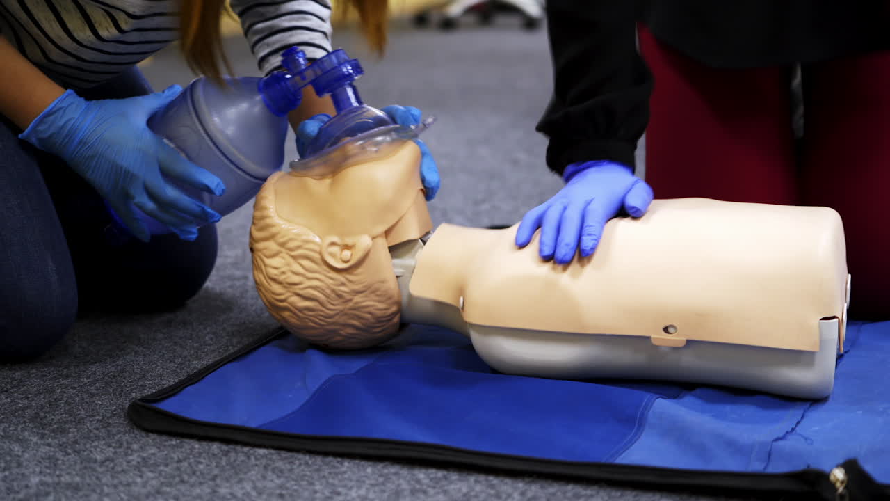 Training compression on a dummy. CPR exercise on a mannequin in the medical center. Teaching skills during heart attack.