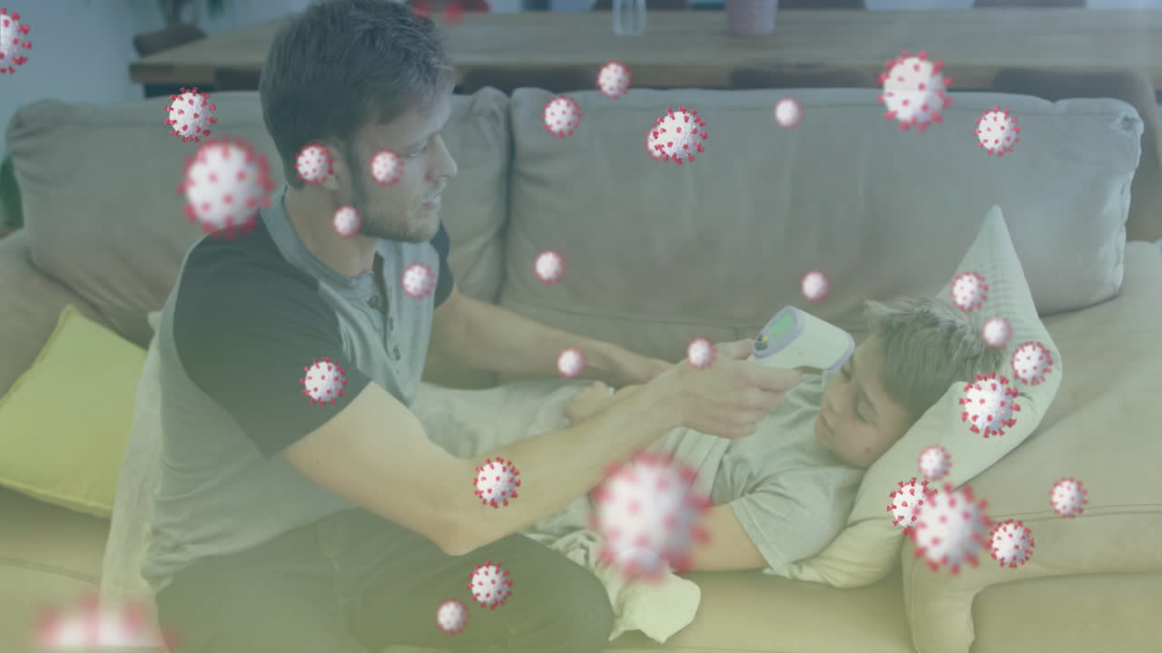 백인 아버지가 아들의 온도를 측정하는 바이러스 세포의 애니메이션
