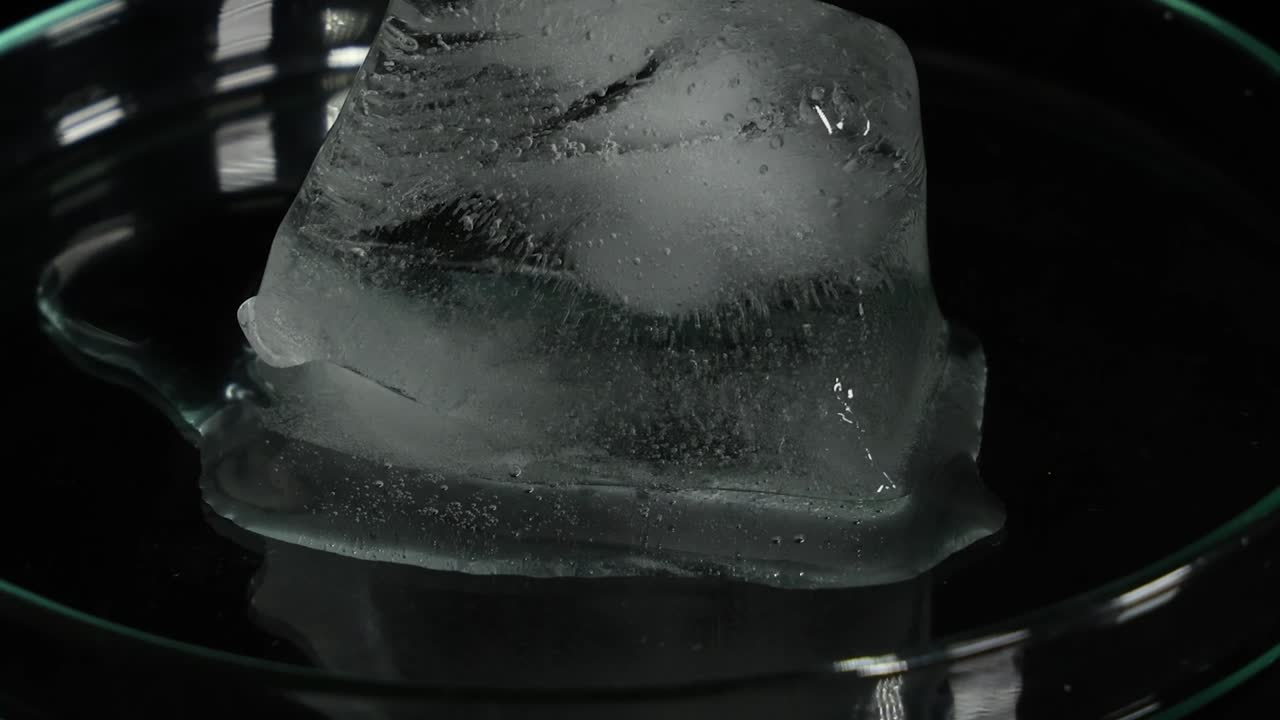 Sequential melting of ice in a clear glass dish