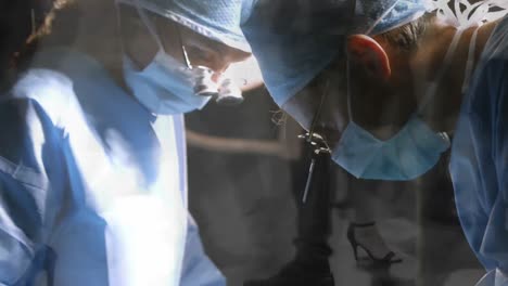 Male-and-female-surgeons-wearing-binoculars-performing-surgery-against-time-lapse-of-people-walking