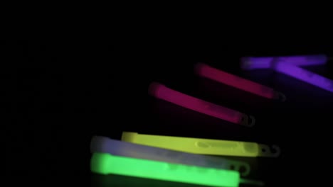 glow sticks falling and landing in the dark