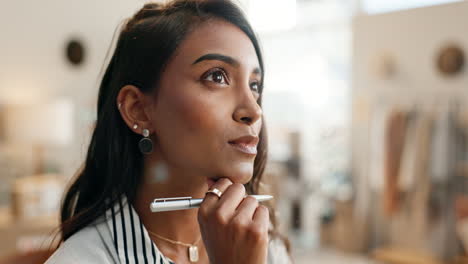 business woman, face and thinking with pen