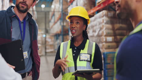 warehouse workers discussing logistics